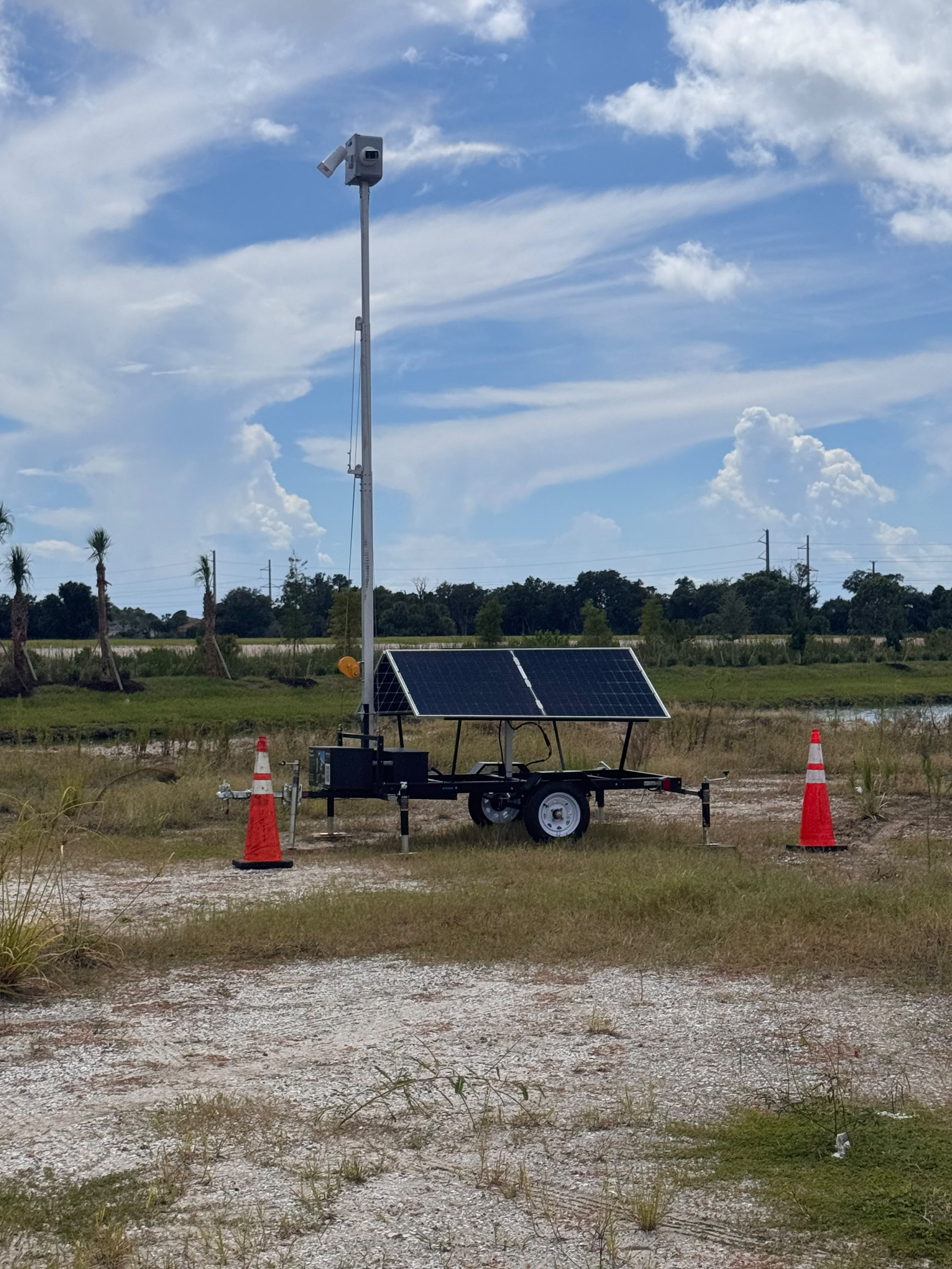 Nexum solar-powered unit deployed near job site with traffic cones